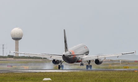 A stock image of a Jetstar plane landing at Sydney airport