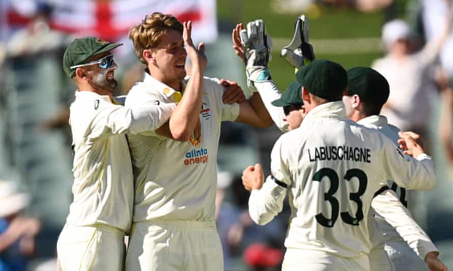 Cameron Green is congratulated by his teammates after his removal of Joe Root.