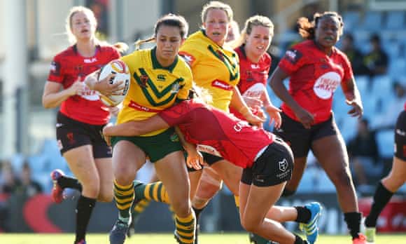 Corban McGregor of Australia is tackled during the Women's Rugby League World Cup match between the Canadian Ravens and the Australian Jillaroos