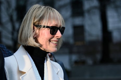 a woman in sunglasses smiles as she leaves court