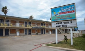 A marquee with the words ‘First Virus Now This’ adorns the boarded up Guidos Seaside Inn in Galveston.