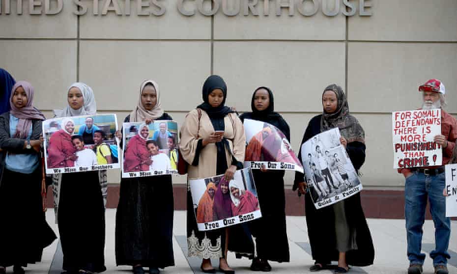 Supporters and family members of the Somalian American men accused of trying to join Isis protest outside the federal courthouse in Minneapolis.
