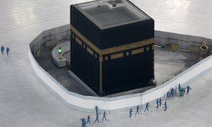 Workers in March disinfecting the ground around the Kaaba, the cubic building at the Grand Mosque. Only 1,000 pilgrims will be able to attend the hajj this year.