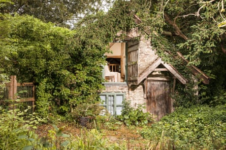 Fairytale 16th-century cottage hidden away in foliage