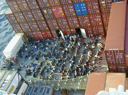 Rescued asylum seekers on board the MV Tampa, north of Christmas Island, in August 2001. The Norwegian freighter was denied entry to Australian waters in a standoff that led to the establishment of offshore detention camps on Nauru and Manus Island.