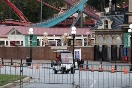 A rollercoaster ride is shuttered and sectioned off by gates