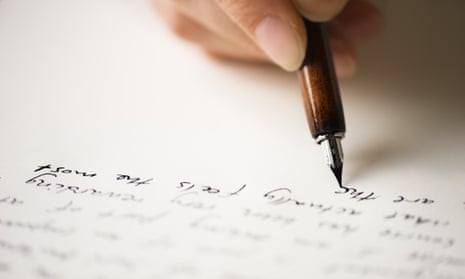 A person writes a letter.