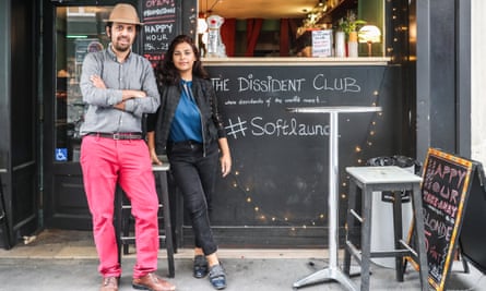 Taha Siddiqui and his wife, Sara Farid, in front of their cafe The Dissident Club in Paris last summer.