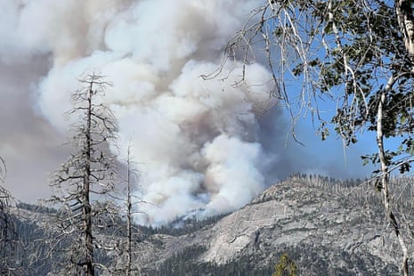Massive smoke plumes from the Dome Fire rise over Yosemite's forested mountains