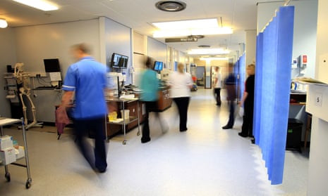 blurred hospital ward, staff not identifiable