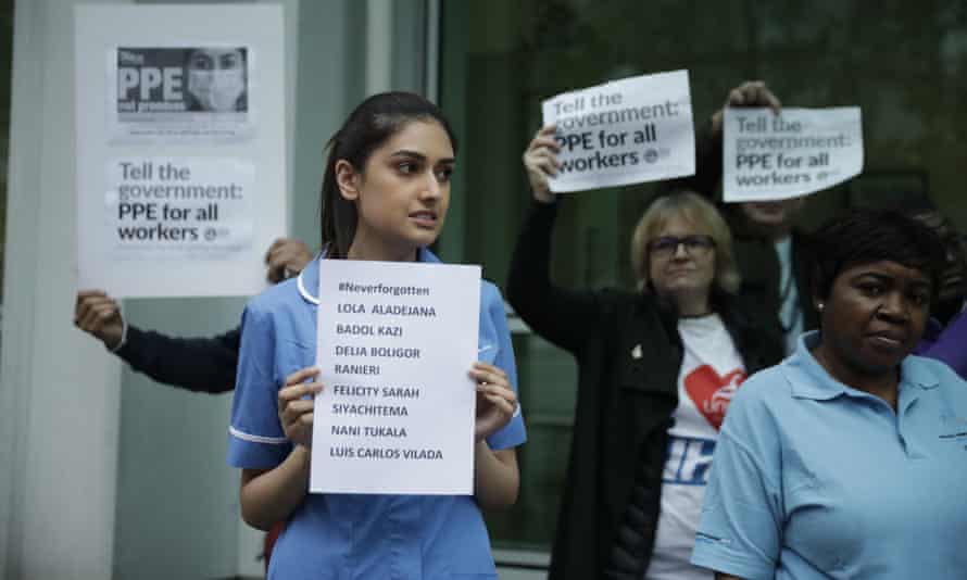NHS workers stage a protest calling for PPE outside University College hospital in London on Tuesday, Workers’ Memorial Day.