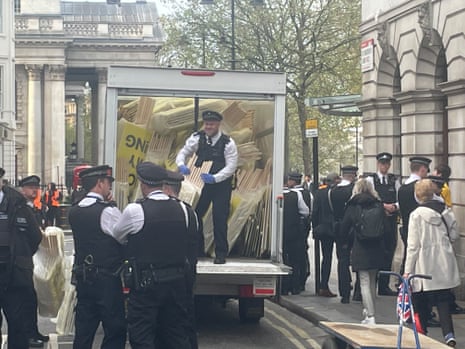 Police confiscating signs from a peaceful anti-monarchy demonstration