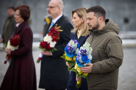 Ukraine’s President Volodymyr Zelenskiy with his wife, Olena, and Latvian President Egils Levits with his wife, Andra, visit Cemetery of the Defenders in Lviv, Ukraine.