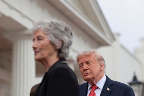 Donald Trump looking towards Catherine Connolly.
