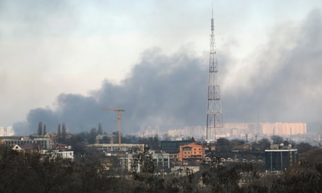 Smoke rises over the city after shelling hit Kyiv.