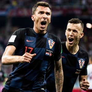 Mario Mandzukic celebrates with Ivan Perisic after scoring Croatia’s opening goal against Russia at the Nizhny Novgorod Stadium.