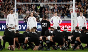 Owen Farrell and the England team look on as the All Blacks perform the Haka.