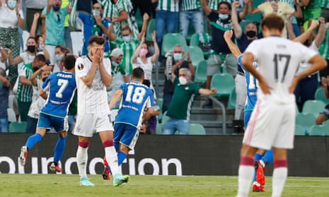 Celtic players react after Juanmi’s shot goes in off the post for Real Betis’ fourth goal in Seville.