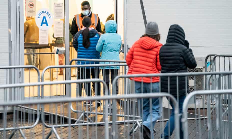 People arrive at a Covid-19 vaccination centre at Elland Road in Leeds, Yorkshire, on Saturday.