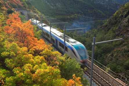 Train traveling through scenic European countryside with multiple countries represented
