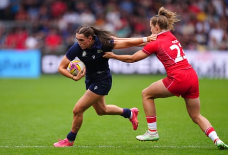 Scotland’s Emma Orr (left) attempts to evade a tackle from Wales’ Carys Cox.
