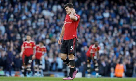 Manchester United’s Harry Maguire and teammates react as the team sink to defeat at Manchester City.