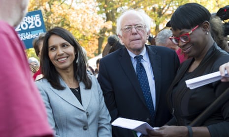 Tulsi Gabbard (left) with Bernie Sanders at a rally to stop the Trans-Pacific Partnership (TPP) on 17 November. 