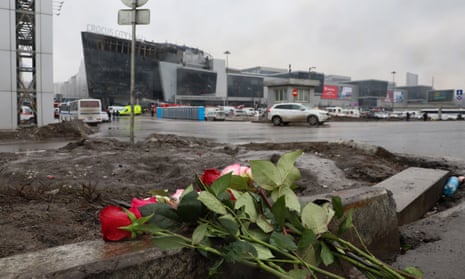 Flowers are seen left at the scene of the gun attack at the Crocus City Hall concert hall in Krasnogorsk, outside Moscow.