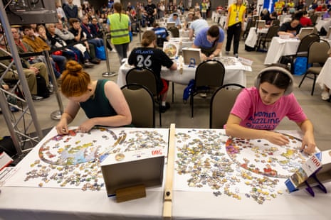 Two people working separately on circular puzzle