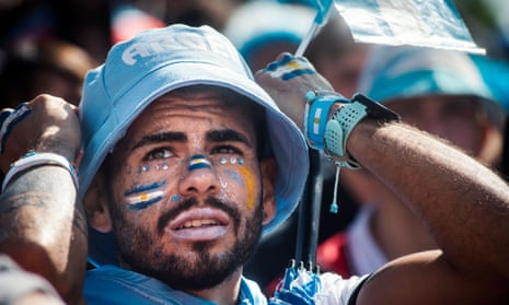 An Argentina fan in Buenos Aires watches on in disbelief as Saudi Arabia win 2-1.