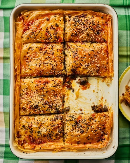 A filo pastry bake in a dish, with a slice removed