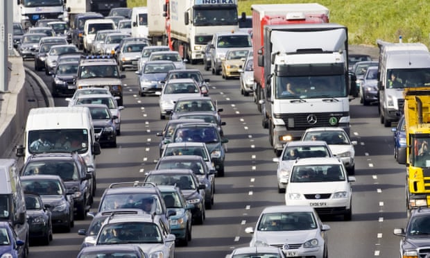 Traffic congestion cars and trucks on M25 motorway, London