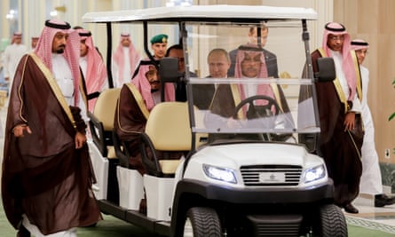 King Salman bin Abdulaziz Al Saud with President Putin before talks on Monday in a golf-type buggy