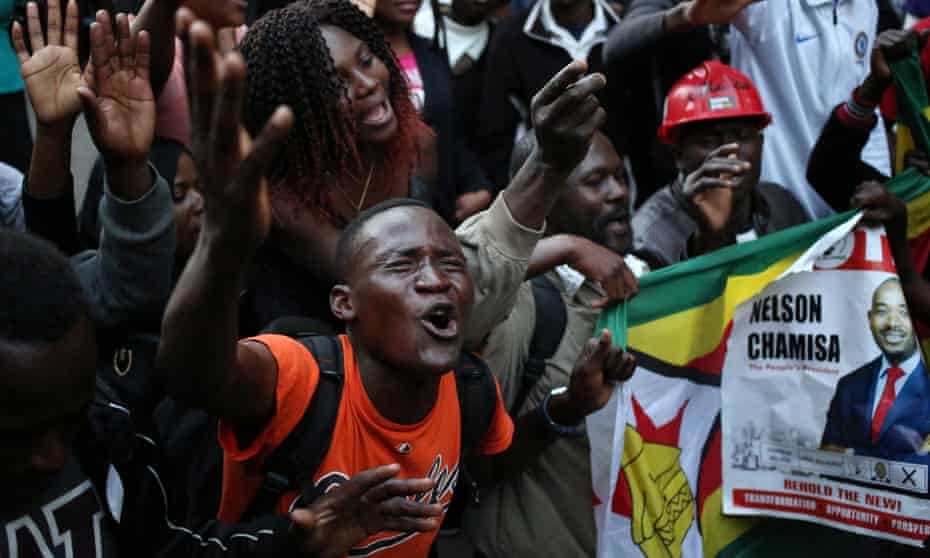 MDC supporters celebrate outside the party’s headquarters in Harare