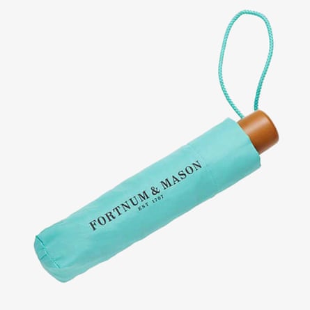 A Fortnum & Mason Eau de Nil Umbrella in nranded turquoise, closed and in the sleeve.