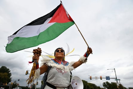 A pro-Palestinian demonstrator waves a flag during a protest