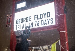 Billy Briggs changes a sign to read ‘George Floyd Trial In 76 Days’ in Minneapolis, Minnesota