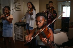Athena Amos and members of the Ensemble Nabanga, Vanuatu’s first youth orchestra, rehearse during an overseas trip in Brisbane