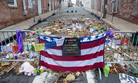 Flowers, candles and other items are placed in memory of Heather Heyer and for those affected by the violence at the site where a vehicle smashed into counter-protesters in Charlottesville, Virginia
