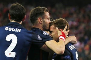 Antoine Griezmann, right, receives a smacker during the celebrations.
