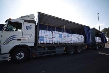 Trucks carrying aid wait to enter the Gaza Strip at the Kerem Shalom crossing, in southern Israel, on Thursday.