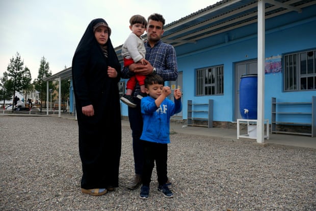 Hafizullah with his pregnant wife, Shaiesta, and their two young children at a transit camp in Herat, where they were taken after being arrested in Tehran, Iran