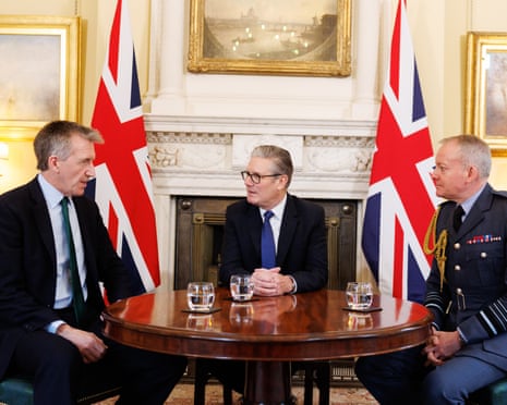 Jarvis, Keir Starmer and Sir Richard Knighton sitting at a table in front of two UK flags