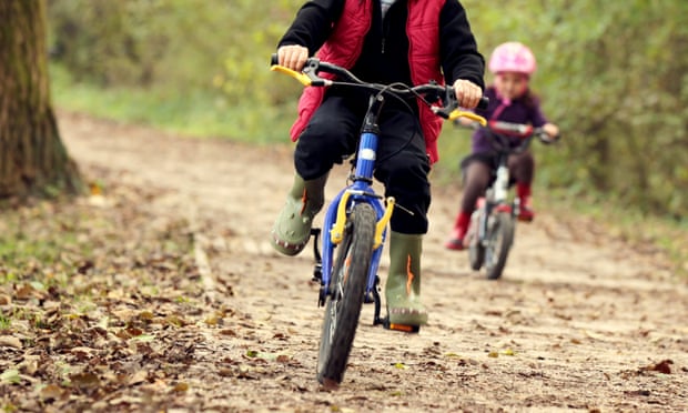 A boy and girl cycling