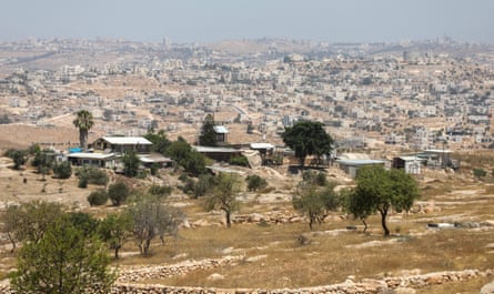 Landscape view of Susya village with Hebron on the hill beyond