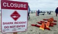 A sign posted indicates the closure of a beach following a shark incident