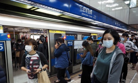 Commuters in Taipei, Taiwan. Officials have told people to continue wearing masks to combat the spread of Covid-19.