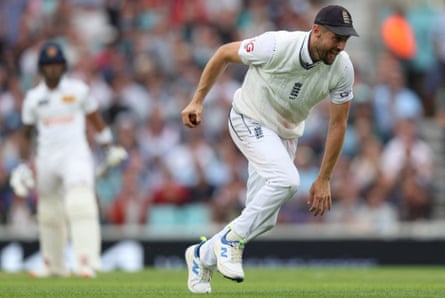 Chris Woakes wheels away in celebration after taking a catch off Pathum Nissanka