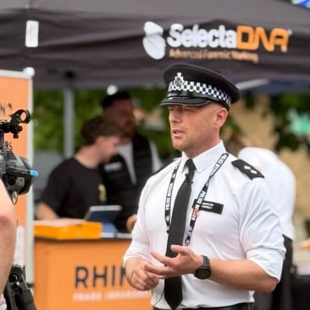 The inspector talks to a camera by a stall for SelectaDNA