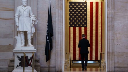 A member of staff passes through the Rotunda at the US Capitol